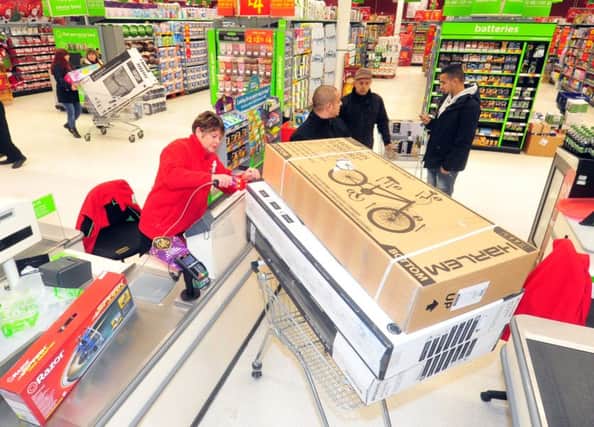 28 November 2014.......    Shoppers at the till with their bargains Picture by Tony Johnson