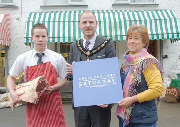 Lord Mayor of Armagh, Banbridge and Craigavon, Cllr Darryn Causby with Joel Haffey from Trader D Butchers, Waringstown and Anne Wilson owner of the Post House Café, Waringstown