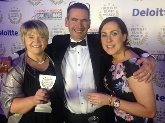 The National Trust Giants Causeway is the UKs Best Heritage Attraction. Picking up the prestigious British Travel Award 2015 at the gala ceremony in London are  Esther Dobbin, Commercial and Visitor Operations Manager, Alastair Walker, Giants Causeway Site Manager and Catherine McAuley, Retail Supervisor.