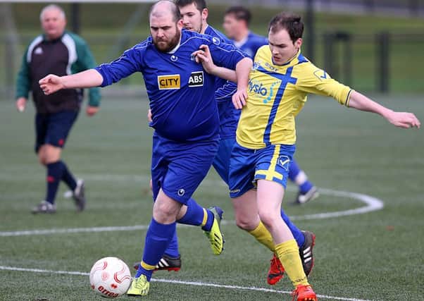 Roe Rovers Daryl Mulgrew and Churchill's Chris Maguire in action on Saturday. INLV4915-306KDR