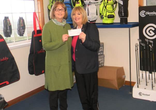 Pearl Woodburn (left) member of Foyle NSPCC receiving a donation of £500 from Faughan Valley Golf Club Lady Captain Celine McIvor.