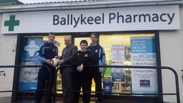 Ballykeel pharmacy proprietor  Lindsay Gracey presenting Ballymena Utd u19s with a match ball for Saturday's game versus Ballyclare to youth team player Jonny Logan. Also in the picture is Kyle Adams and youth team player Josh McCready.