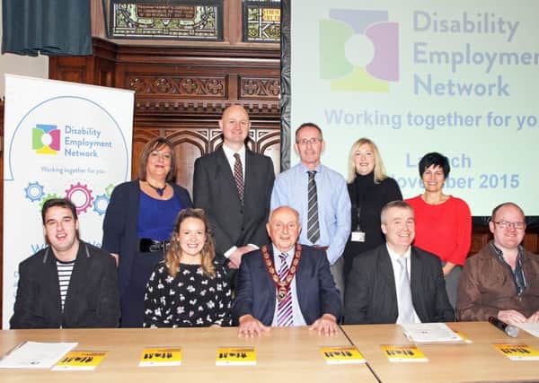 The Deputy Mayor Alderman Thomas Kerrigan, who officially launched the Disability Employment Network event in the citys Guildhall, pictured with guest speakers and committee members.  From left (seated) are Lee Snodgrass, Margaret McDaid and Martin Quinn, with the WHSCT and Deryl McDonough, City Hotel.  Standing, Kaye McIvor, DCSDC, Philip Burns and Paul OHagan, with DEL, Debbie Roger, DCSDC and Breeda Doherty, Cedar Foundatioin.  4715-1109MT.