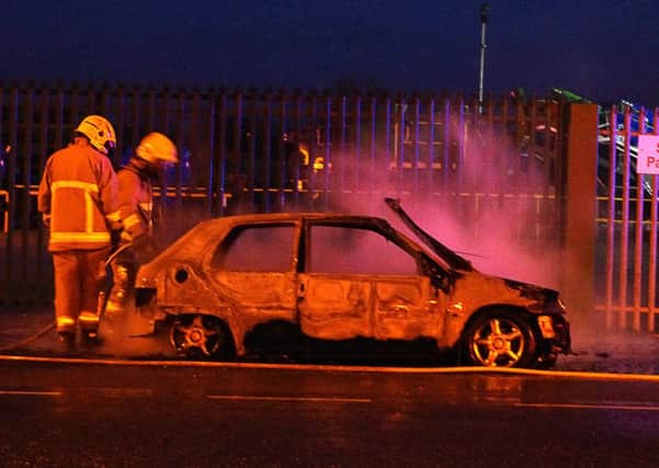 Firefighters at the scene of the car fire on the Moor Road, Clonoe