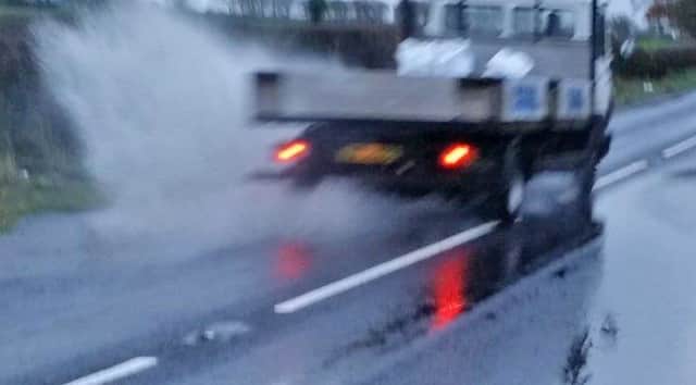 ONE of our readers has kindly sent us this picture of excess surface water on the road from Ballymoney - Dervock. The reader feels that it is very dangerous to motorist especially coming from Dervock as it is on a bend and vehicles are in it before they can slow down. It has been reported to the N.Ireland Water Hotline, who alledgely stated that it was due to part of the road sinking.INBM49-15 902F.