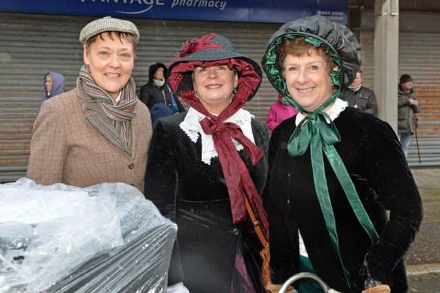 Entering into the spirit of the occasion are Maggie Holmes, Elsie French and Ruth Clarke. INCT 48-036-PSB
