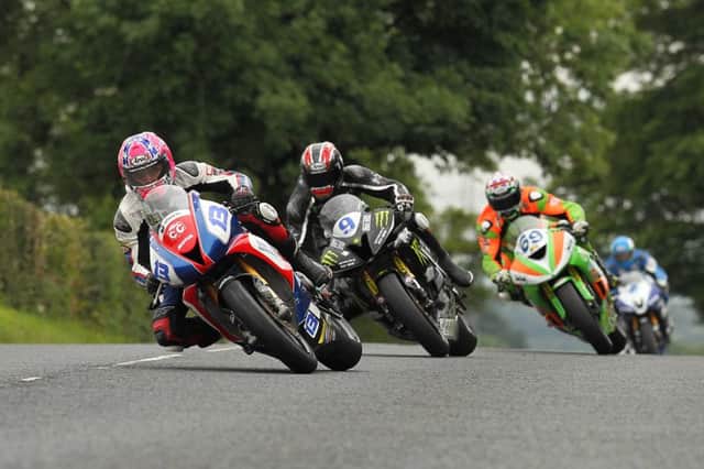 Lee Johnston leads Ian Hutchinson, Glenn Irwin and Dean Harrison during the Supersport Race at 2015 Ulster Grand Prix.