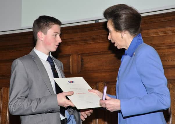 Cameron receives his award from HRH The Princess Royal.  INCT 49-741-CON