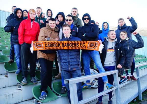 Carrick Rangers fan John Gorrod (centre) pictured with supporters of Russian club FC Volga Tver.  INLT 49-998-CON