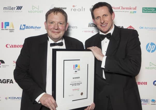 Jonathan Megarry (right), MD of Nicholson Bass, receiving the award for Best Irish Printed Magazine' from Eamonn Dunne. INNT 50-503CON Pic by Peter Houlihan