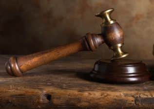 Judge's court wig and hammer or gavel