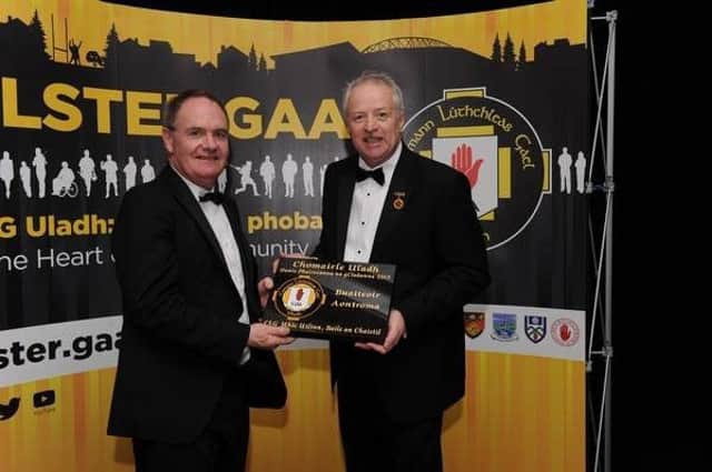 Dessie on behalf of McQuillan's GAC, Ballycastle receiving the Best Club Ground in Antrim' award at the Ulster GAA Presidents Awards at the weekend from Ulster GAA President Martin McAviney.