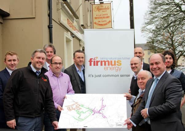 Pictured with Councillor Thomas OHanlon; Councillor Sam Nicholson; Councillor Thomas Molloy; Councillor Garath Keating and businessman Ivor Cowan are Philip Hewitt; Michael Anderson; Michael Scott, Managing Director; Ciaran Brennan and Paul Stanfield, Sales Director all from Firmus Energy