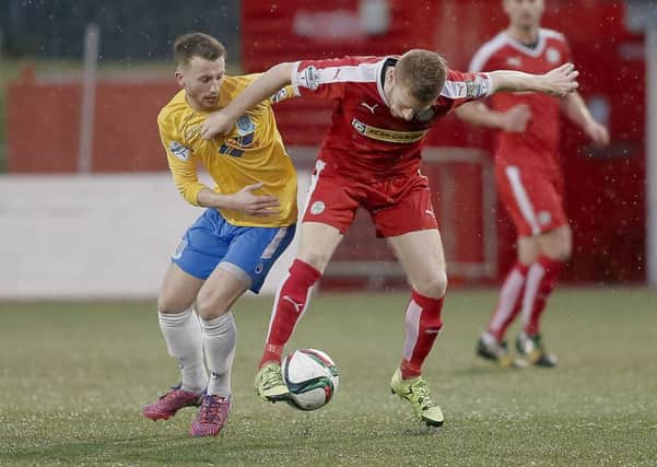 Cliftonville's Stephen Garrett and Ballymena's William Faulkner in action during the Danske Bank Premiership clash at Solitude. Picture: Press Eye.