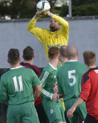 Tuda Murphy saved FOUR penalties as Town made it through to Tuesday's draw. INBL1548-262EB