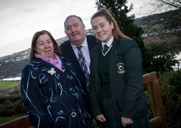 BOWING OUT OF POLITICS. . . .SDLP stalwart Pat Ramsey, MLA pictured  last week with his wife Chris and daughter Aine at one of his favourite spots at Termonbacca, overlooking the River Foyle. DER4815MC027