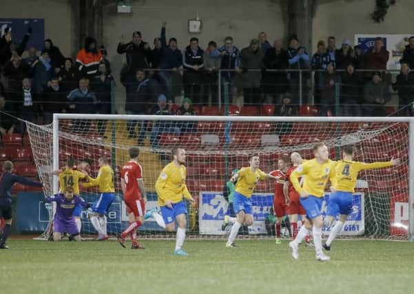Gary Thompson forces home Ballymena United's second goal in Saturday's defeat at Cliftonville, in front of the travelling support. Picture: Press Eye.