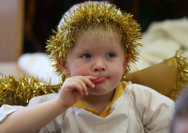 Jamie in pensive mood before going on stage in the Buick PS Playgroup Nativity play. INBT 51-102JC