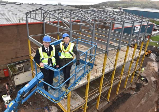 Martin Agnew, Managing Director, Henderson Group and John Agnew, Chairman, Henderson Group survey the construction work that has already begun at the Mallusk headquarters of the local retail, property, foodservice and wholesale business. The Group has announced a £25m investment in its new facilities, that will house several departments under one roof, as well as the purchase of land that will house the construction of a new distribution centre, trailer park and head office facility. INNT 50-540CON