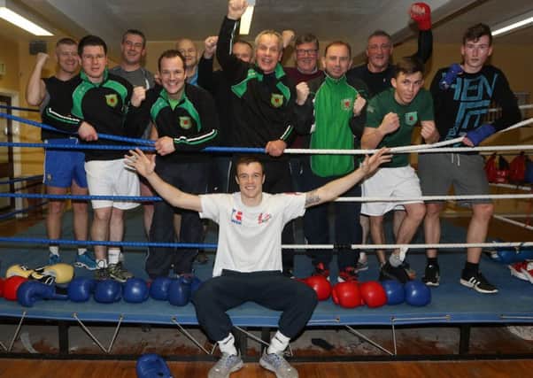 All Saints Boxing Club members show their delight at the news that their star boxer Steven Donnelly is bound for next year's Olympics. INBT 50-176CS