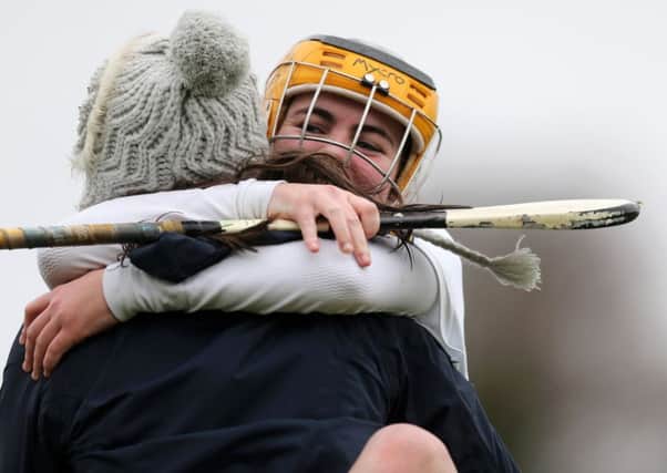 St Killian's corner-forward Aimee McDonnell celebrates with team-mate Mary Kane, who missed the game through injury, at the end of Saturday's Fr Davies Cup final win over St Patrick's Keady at the QUB playing fields, Belfast. INLT 50-920-CON Pic by John McIlwaine