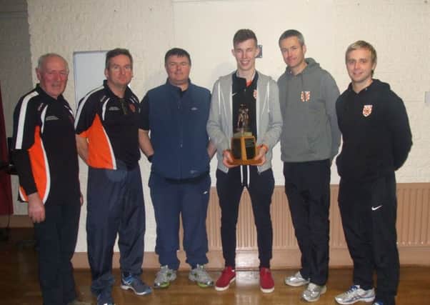 The Clann Eireann coaches with captain Sean McCarthy.