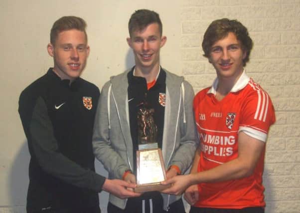 Thomas French, Sean NcCarthy and Rory OConnor with the trophy.