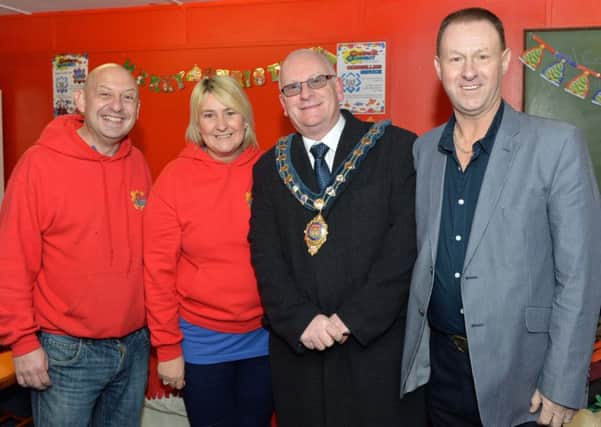 Mayor of Mid and East Antrim Borough Council, Councillor Billy Ashe is pictured with Tracey McNickle (project manager), Jonny Ewart (left) and Brian Shields at the official opening of Carrick Connect`s new drop in centre. INCT 48-025-PSB