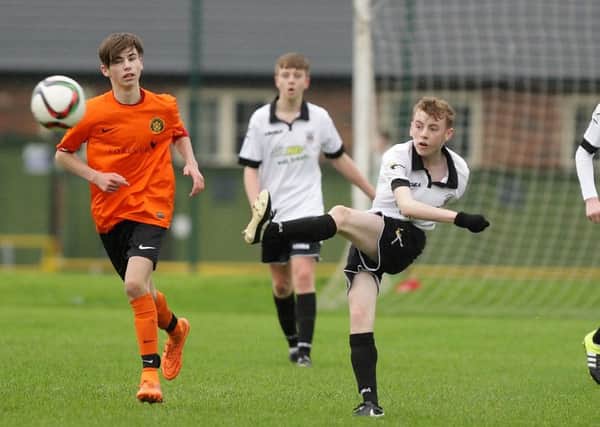 Action from the under-16 Shield semi-final between Lisburn Distillery and Carrick. US1549-508cd  Picture: Cliff Donaldson
