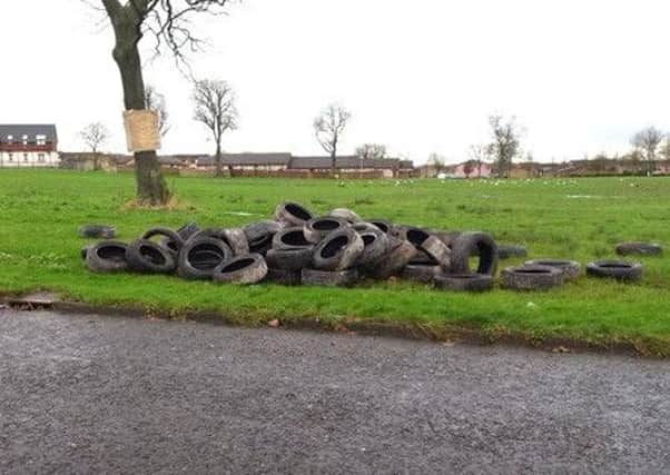 Dozens of tyres were dumped on the green at Manse Way last week. They were later removed by the Housing Executive.
