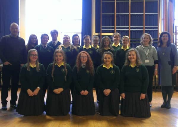 Pupils of St Ronan's College who will be taking part in a Christmas production The Music Box with Peter Corry. Also pictured are Ronan Sharkey, a music teacher at St Ronan's who is also in the show, Aoibheann Lamb, head of music and principal Michelle Corkey