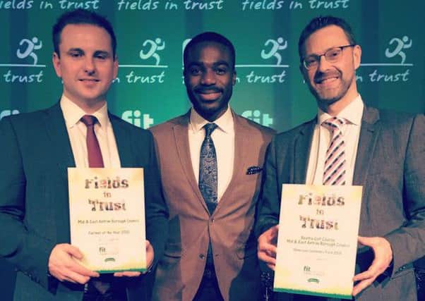Councillor Andrew Wilson (left) and MEA Director of Operations, Philip Thompson with presenter Ore Oduba at the Fields in Trust awards.  INCT 51-723-CON