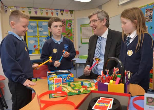 Education Minister John O'Dowd and pupils Adam Johnson (9), Reilly O'Neill (9) and Jude Fitzsimons (9) having fun at the opening of the new £145,000 additional needs facility at Hazelwood Integrated Primary School. INNT 51-509CON Pic by Aaron McCracken, Harrisons