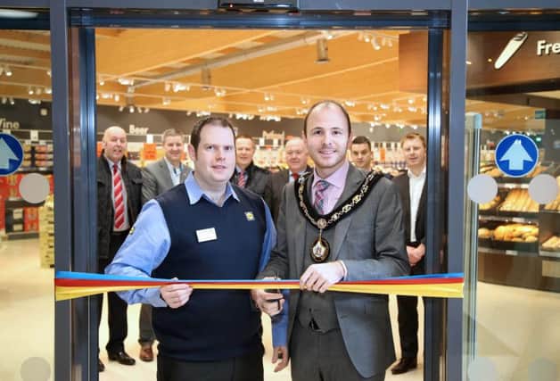 The Lord Mayor of Armagh City, Banbridge and Craigavon Borough Mayor Councillor Darryn Causby joined Lidl Northern Ireland branch manager Justin Ford to celebrate the launch of its very first 'new concept' store in Banbridge. Picture by Darren Kidd / Press Eye