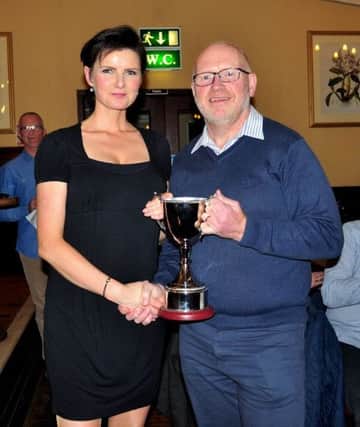 Ciara Toner receiving the Female Challenge Cup from Kenny Bacon