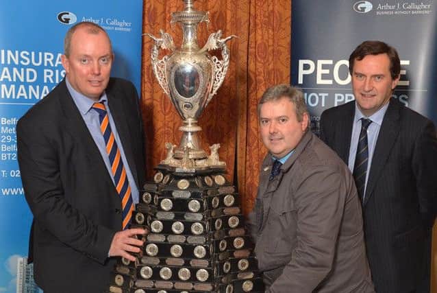 Stephen Hanna  of Donaghcloney CC at the draw for the early rounds of the newly-sponsored Northern Cricket Uion Arthur J Gallagher Senior Challenge Cup with Gordon Markey of AJG (left) and the NCU President, Peter McMorran.