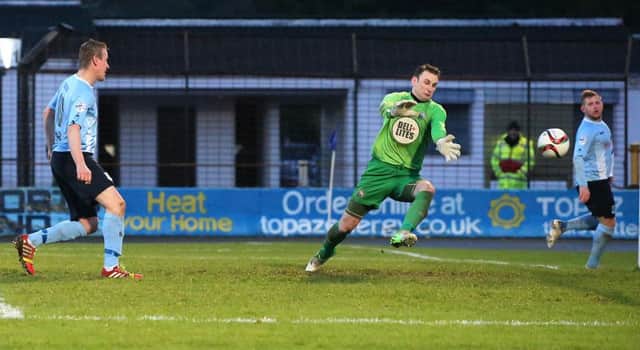 Allan Jenkins fires past goalkeeper Jonathan Parr for the second his his three goals in Ballymena United's 4-2 weekend win over Warrenpoint Town. Picture: Press Eye.