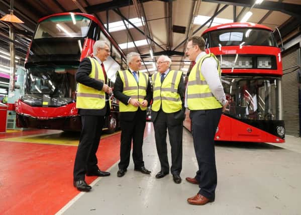 Enterprise, Trade and Investment Minister Jonathan Bell is pictured at Ballymena bus builder Wrightbus with  Mark Nodder (Wrightbus), William Wright (Wrightbus) and Steven Francey (Wrightbus).
Picture by Kelvin Boyes / Press Eye.