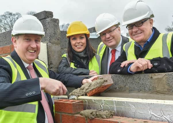 Social Development Minister, Mervyn Storey MLA, (L) Nadine Ritchie, Connswater Homes, Jonathan Craig MLA and Paddy Gray, Connswater Homes.