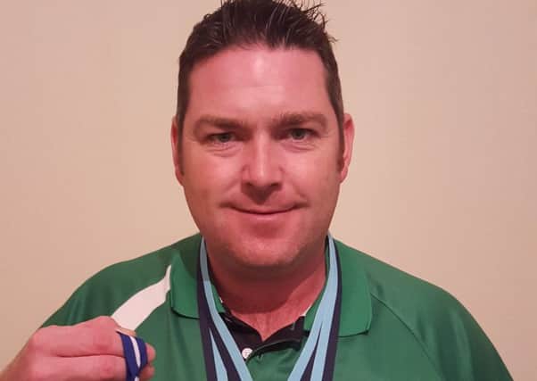 Lisburn bowler Neil Mulholland has won three world class medals within a month after success in Australia and Cyprus. The globetrotting bowler has followed up his Commonwealth Games success last year in style with his recent medal haul.