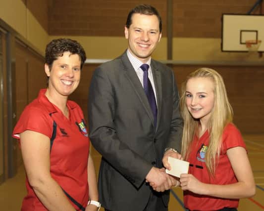 Principal Robin McLoughlin presented Lynsey Orr with the Player of the Tournament at Banbridge Academy Netball Tournament, included is Teacher Heather Lawther ©Edward Byrne Photography INBL1551-208EB