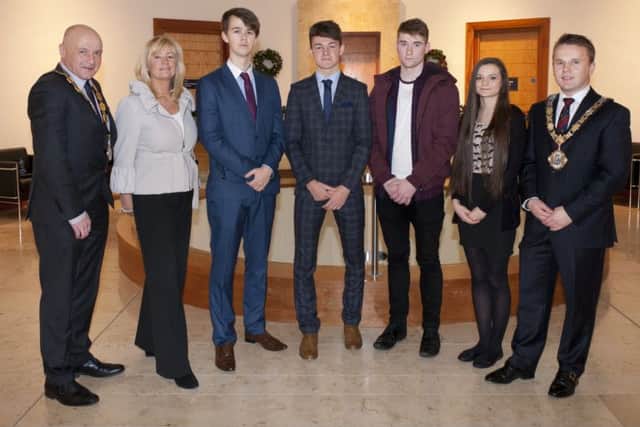 Mayor of Antrim and Newtownabbey, Councillor Thomas Hogg, Deputy Mayor Councillor John Blair and Fiona Gunning, HR Assistant pictured with students from Antrim Grammar who carried out work experience recently at Antrim civic Centre.