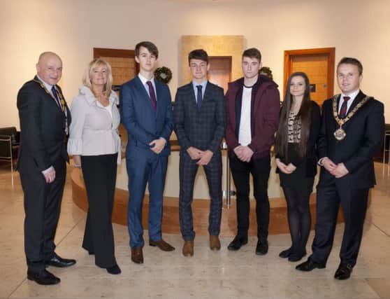 Mayor of Antrim and Newtownabbey, Councillor Thomas Hogg, Deputy Mayor Councillor John Blair and Fiona Gunning, HR Assistant pictured with students from Antrim Grammar who carried out work experience recently at Antrim civic Centre.