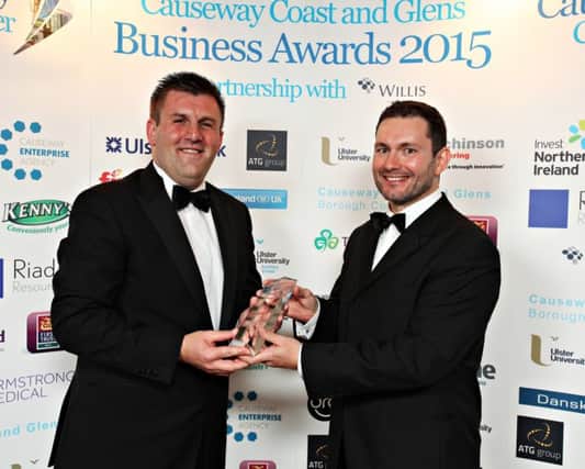 Jason McKnight of the Ulster Bank presents the Business Person of the Year Award to Mark Hutchinson of Hutchinson Engineering.