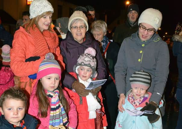 Carol singing in Broughshane village on Friday night at the Christmas lights switch-on. INBT 48-827H