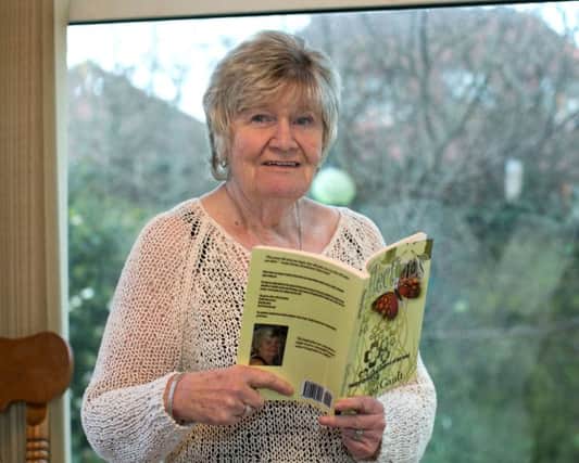 Carrick poet Shirley Gault with her book of published poems entitled Reflections. The book is available through Amazon and Shirley can be heard on the Candy Devine radio show on Friday nights as a featured guest. INCT 17-483-RM