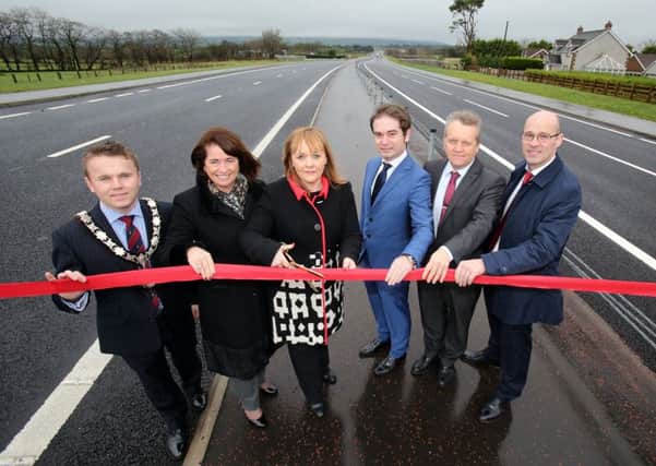 Mayor of Antrim and Newtownabbey, Councillor Thomas Hogg, Deidre Mackle (Transport NI Divisional Manager), Transport Minister Michelle McIlveen, Enrique Nieto (Ferrovial), Adrian Bennett (Costain) and John Cunningham (Lagan) at the official opening of the A8 dual carriageway scheme. INNT 52-509CON