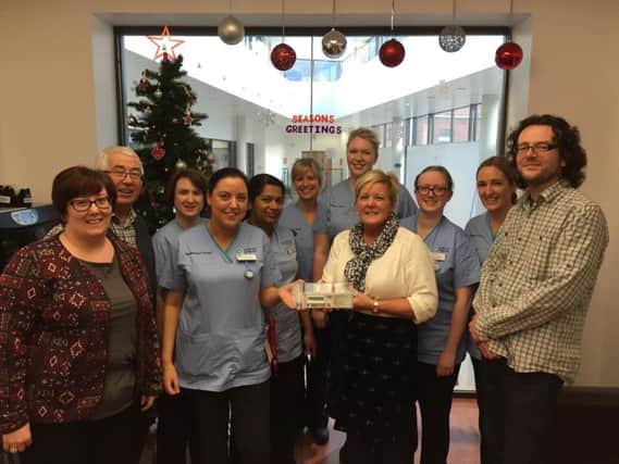 Karen Hendrie, PJ Hendrie, Diana Hendrie and Martin Doyle (The Diamond Bar) and nurses from Ward F at the Mater Hospital. The Hendrie family were presenting the ward with a new Syringe Driver in memory of Christopher Hendrie who passed away in October 2014.