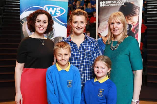Pupils from Sunnylands Primary School, Lewis Bradley and Rihanna Garston alongside Laura Prior, British Council Northern Ireland, teacher Miss Gray and Elaine Steele, W5 educator at Around the World in Story Tales .INCT 51-753-CON