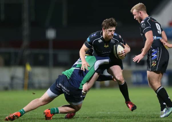 Ballymena's Matthew Rea in action with Ballynahinch's Zack McCall during tonight's First Trust Senior Cup final at the Kingspan Stadium. Picture: Press Eye.
